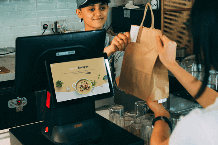 Restaurant staff using POS system